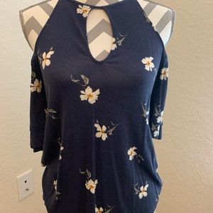 Cute cold shoulder top with high neck.